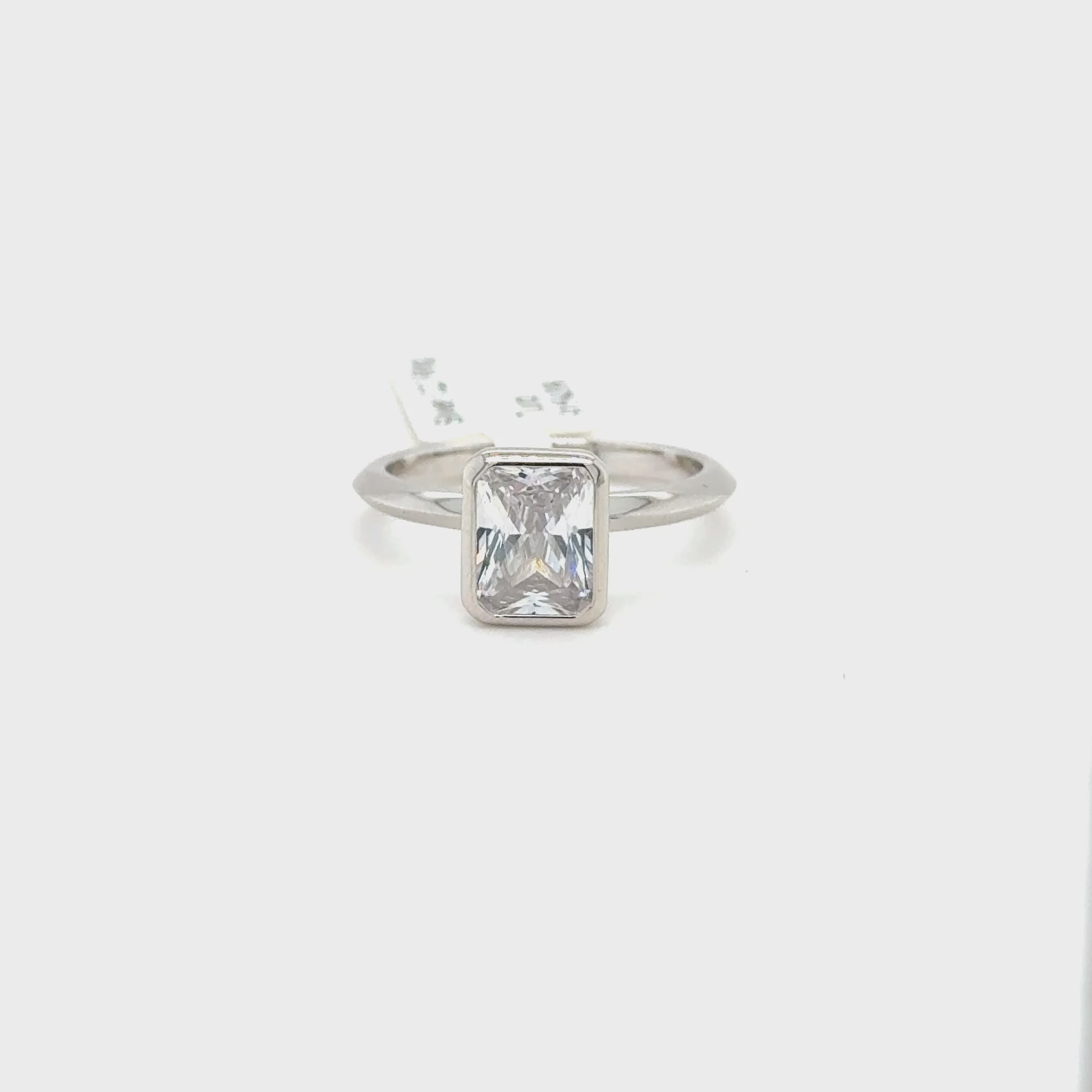 Sterling Silver Emerald Cut Bezel Set Ring with Cubic Zirconia